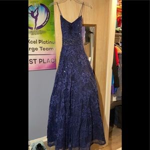 Beautiful dark blue prom dress with lace and sparkles. Size 5.